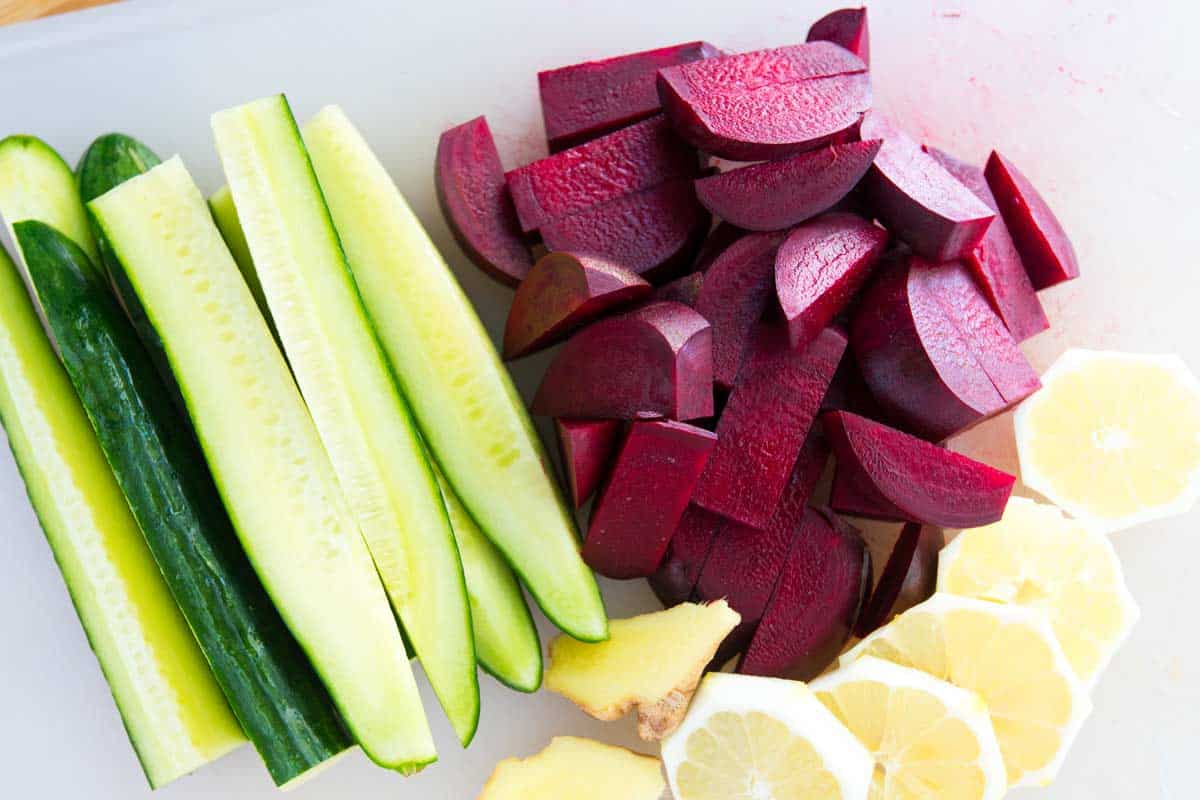 How to Juice Beets -- When juicing, we leave the peel on for beets, ginger, and cucumber. We scrub it very clean with a veggie brush. For the lemons, we peel them and remove seeds.