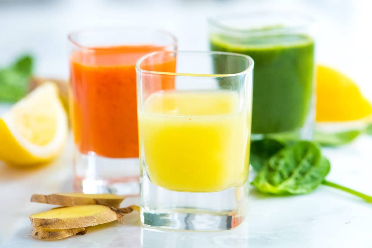 Three Ginger Power Shot Recipes including Lemon Ginger, Carrot Ginger and a Green Apple Ginger Shot