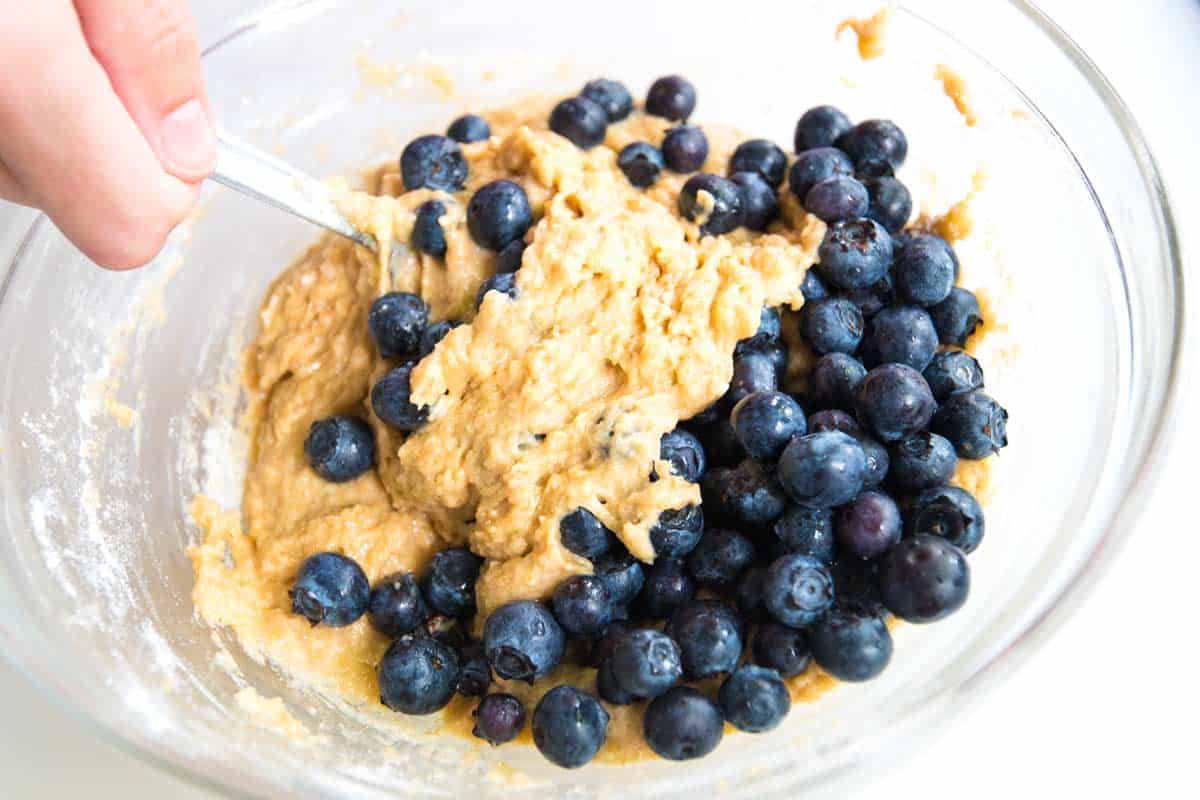 How to Make Easy Banana Blueberry Muffins: Stirring in the blueberries to the muffin batter