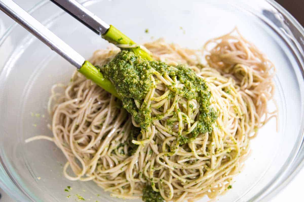 Toss cooked soba noodles with pesto for an easy, fresh meal.