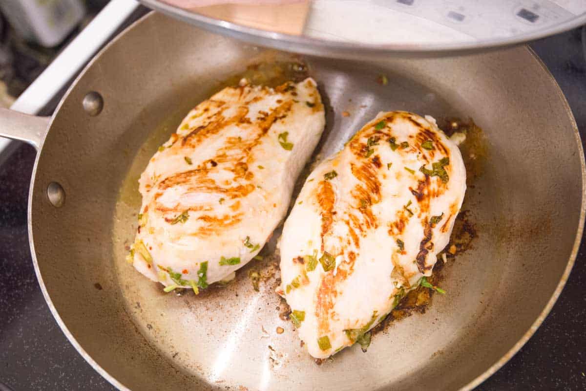 Cook the chicken in a skillet with a lid