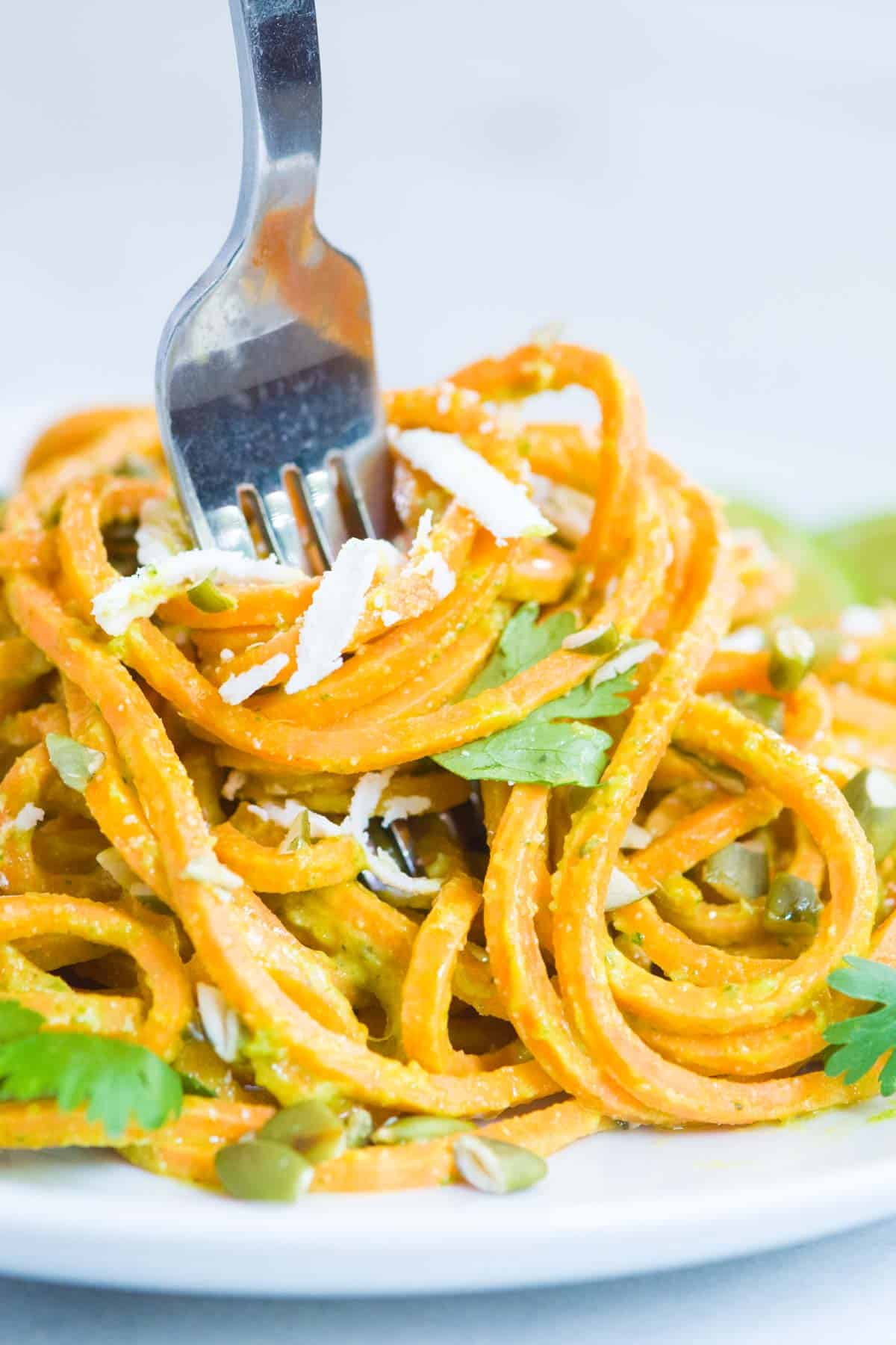 Creamy Avocado Sweet Potato Noodles - close-up with fork emphasizing the creamy avocado pasta sauce