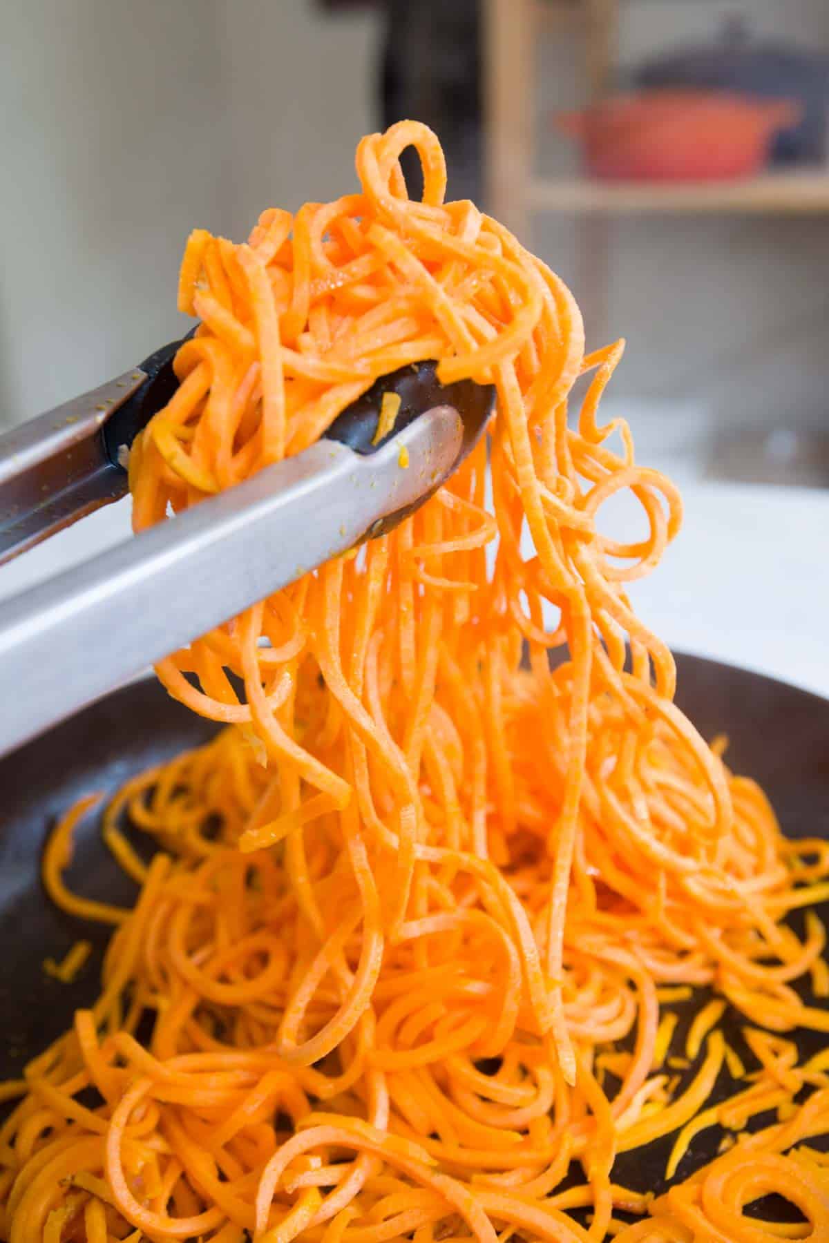 Cooking spiralized sweet potato noodles in a skillet