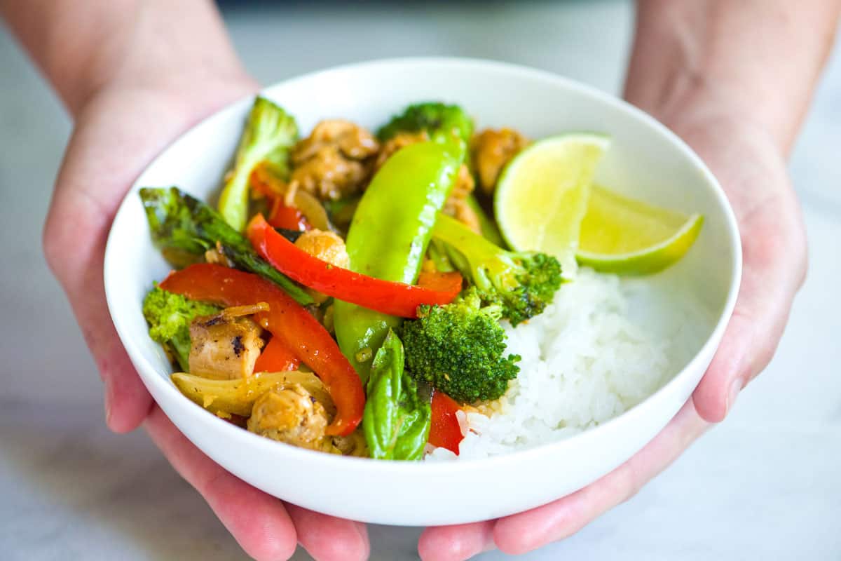 Chicken and vegetables stir fry served over rice