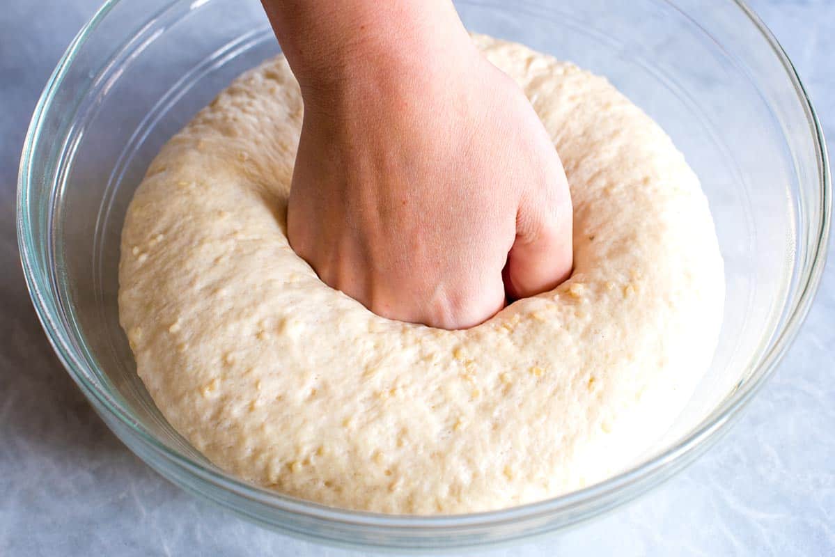 How to Make Garlic Flatbread: punching down the flatbread dough