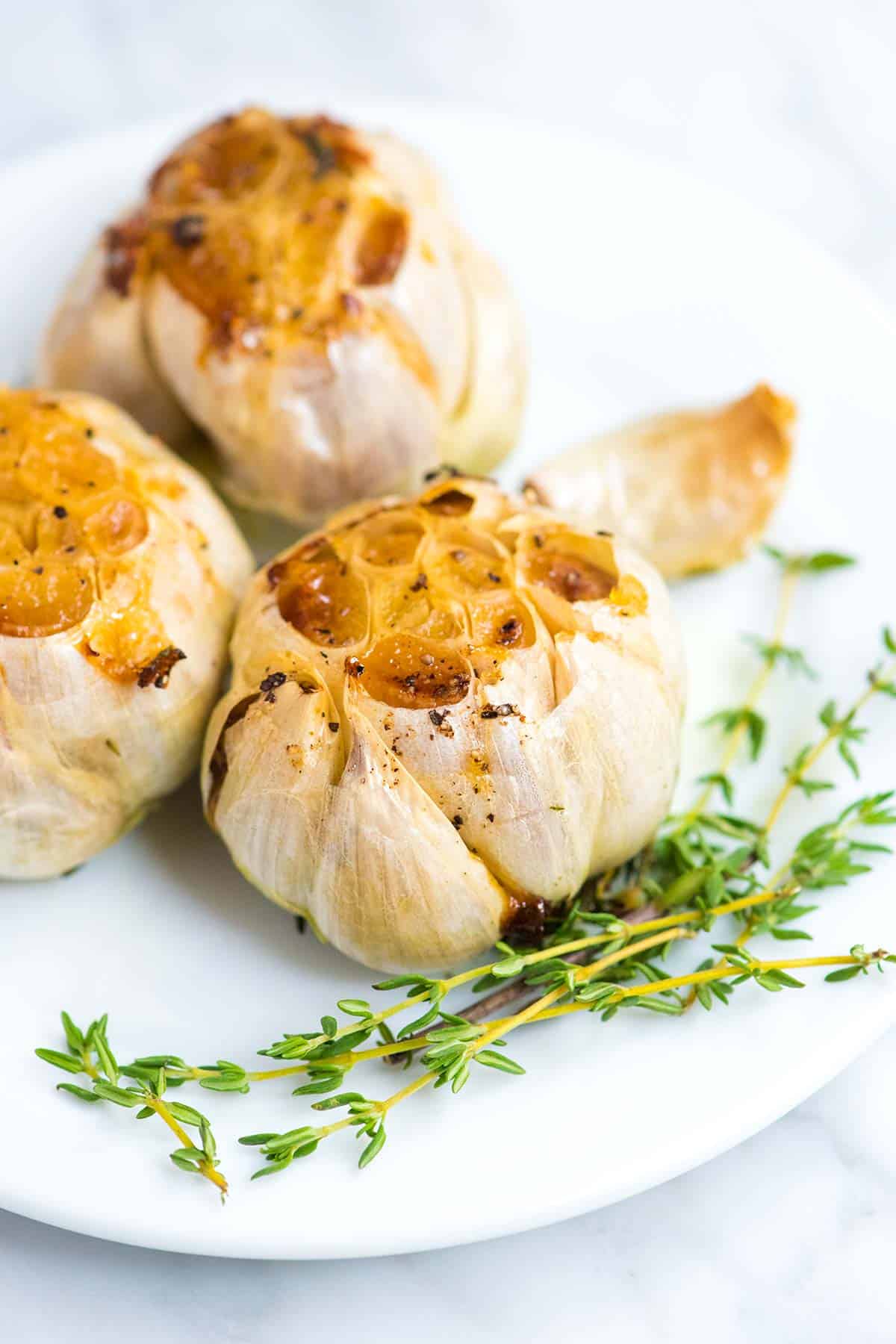 Roasted garlic is one of the best things you can make in your oven. We're sharing how to roast garlic and lots of ways to use it. Roasted Garlic