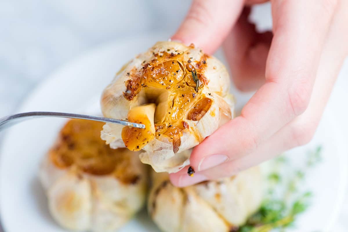 Roasted garlic is one of the best things you can make in your oven. We're sharing how to roast garlic and lots of ways to use it. Perfect Roasted Garlic