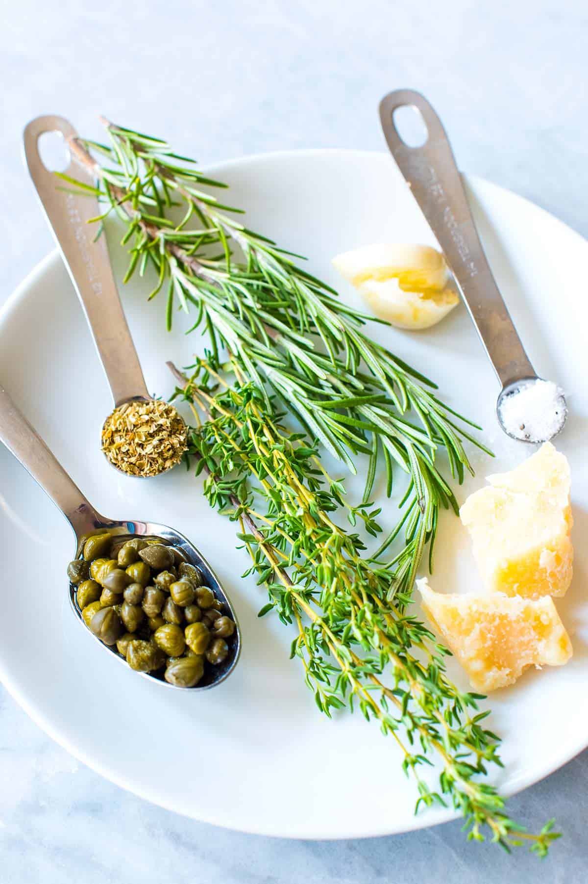 This easy and group-friendly olive oil dip comes together really quickly and it never fails. I mean, who doesn’t want to dip bread into an herby, garlicky, parmesan cheese infused olive oil? Olive Oil Bread Dip Ingredients