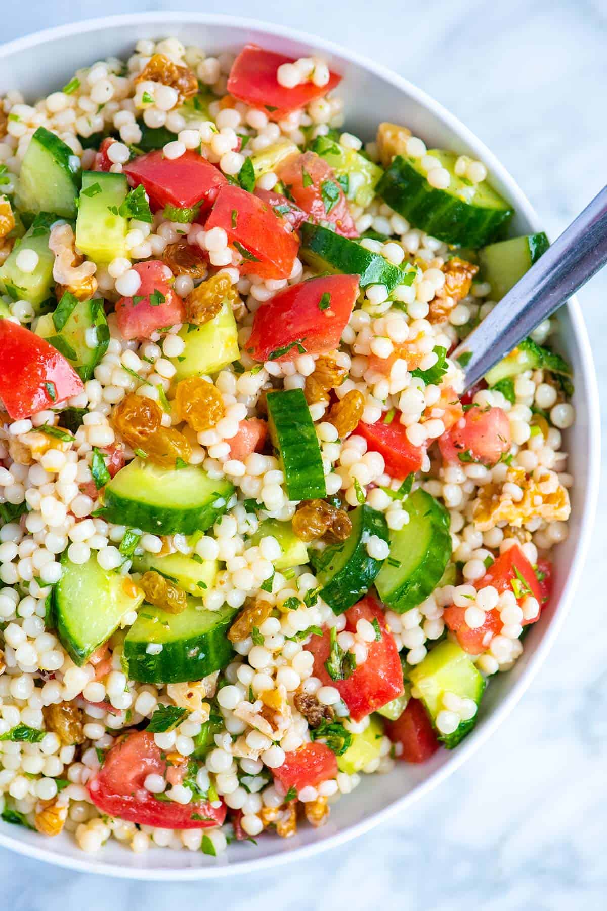 Easy Couscous salad made with pearl couscous (Israeli couscous), tomatoes, and cucumber