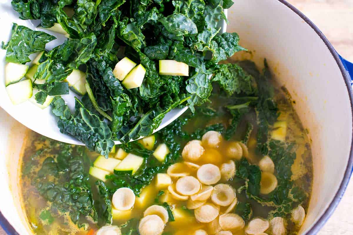 How to Make Chicken Vegetable Soup: Adding the kale and zucchini to the chicken soup