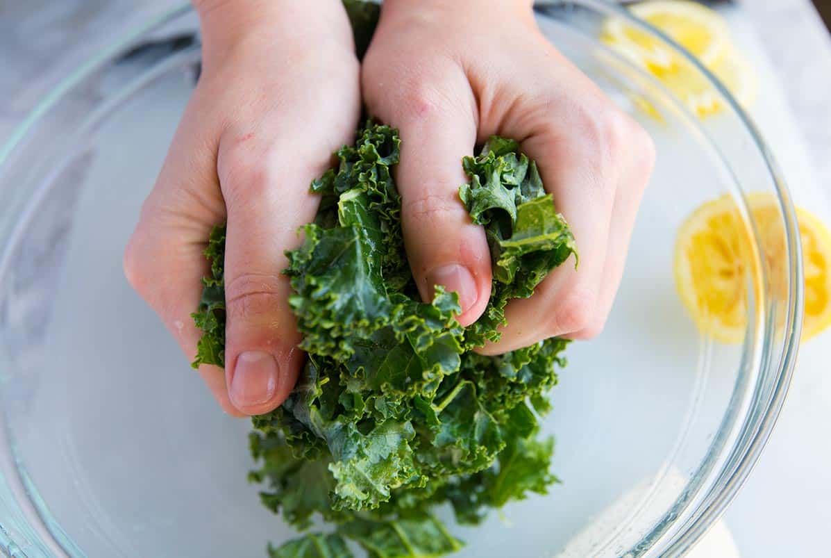How to Make Kale and White Bean Salad: Massaging the kale.