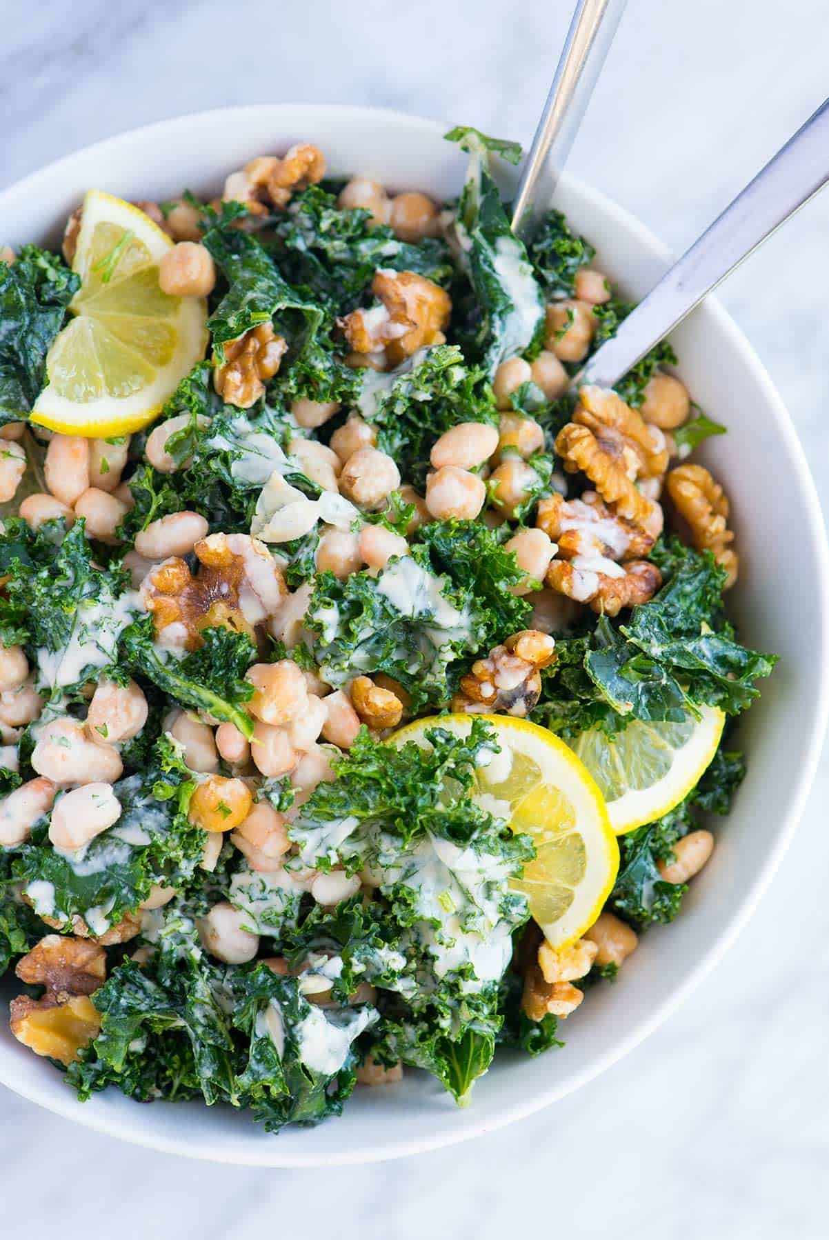 This hearty kale and bean salad is packed with good for you ingredients, is practically crave-worthy and can be made in advance.