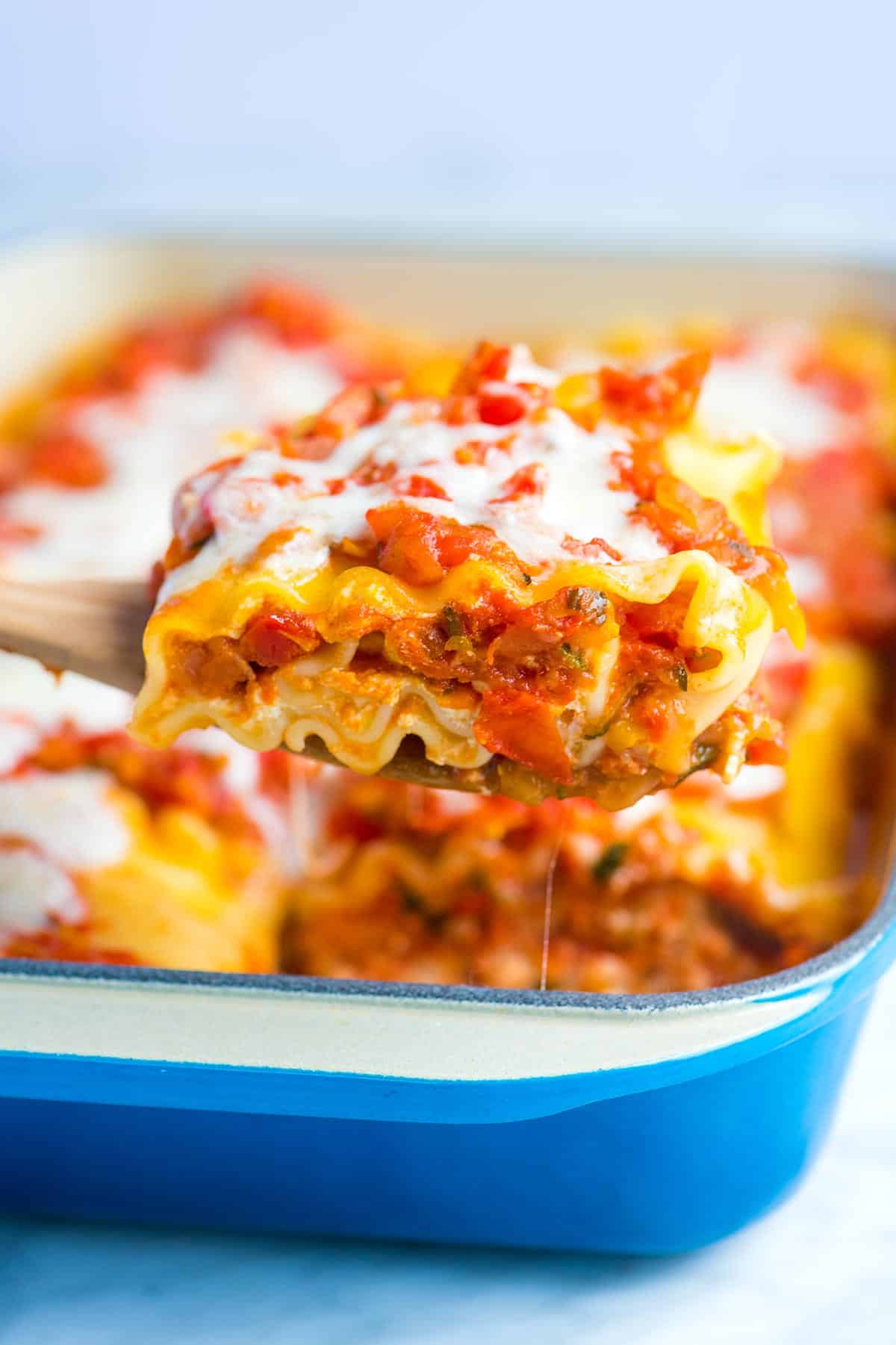 These easy lasagna roll ups with fresh vegetables, a light tomato sauce and cheese are a must make. Make them now or prep and freeze for later.