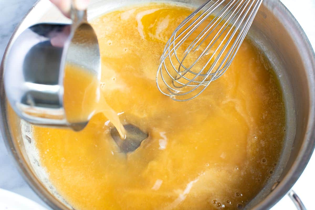 How to Make Gravy: Adding warm stock/broth to a paste made from melted butter and flour makes creamy, thickened gravy.