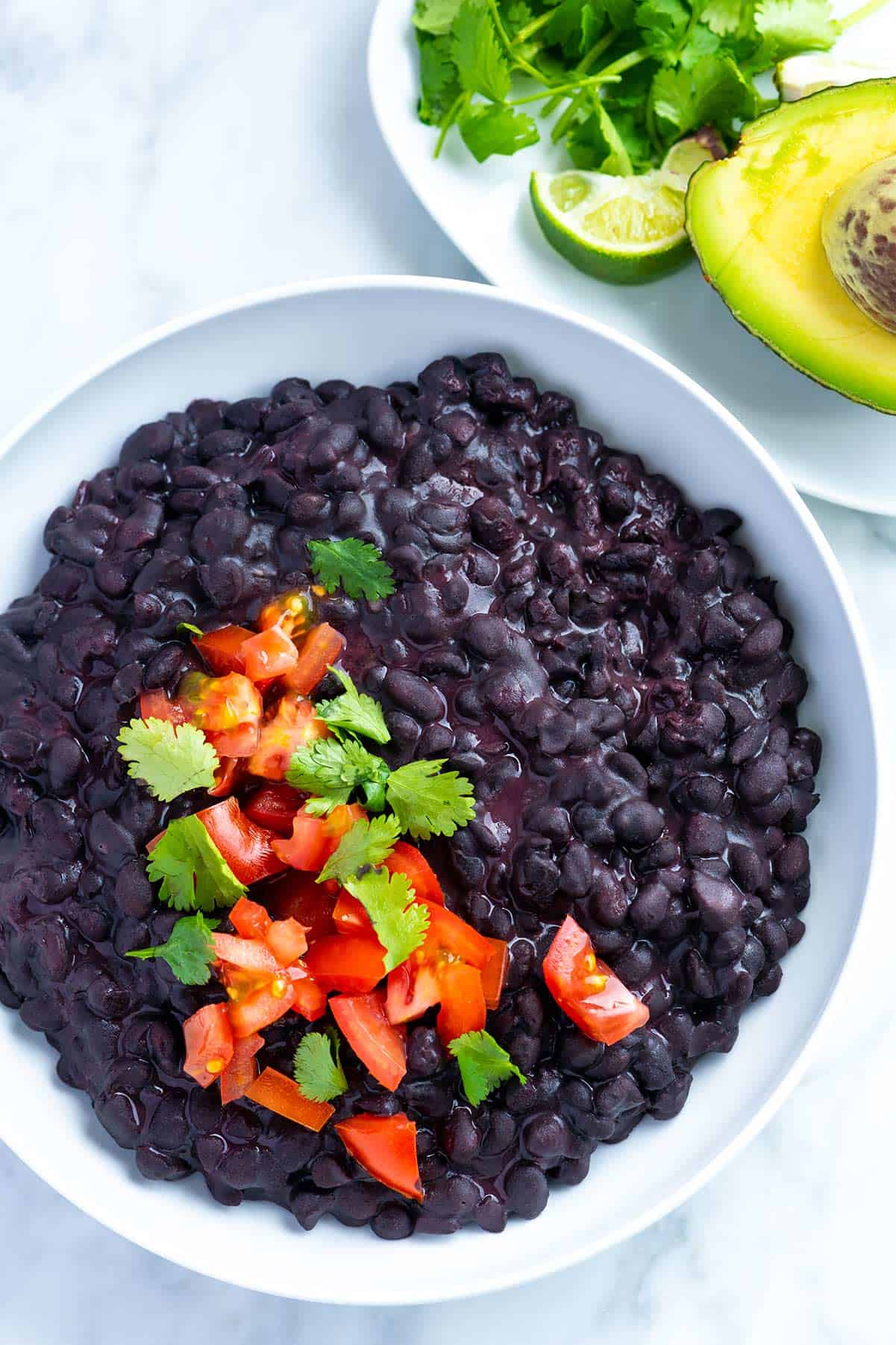 Easy creamy coconut black beans recipe made completely from scratch. See how to make the creamiest black beans ready for any meal. You only need one pot!