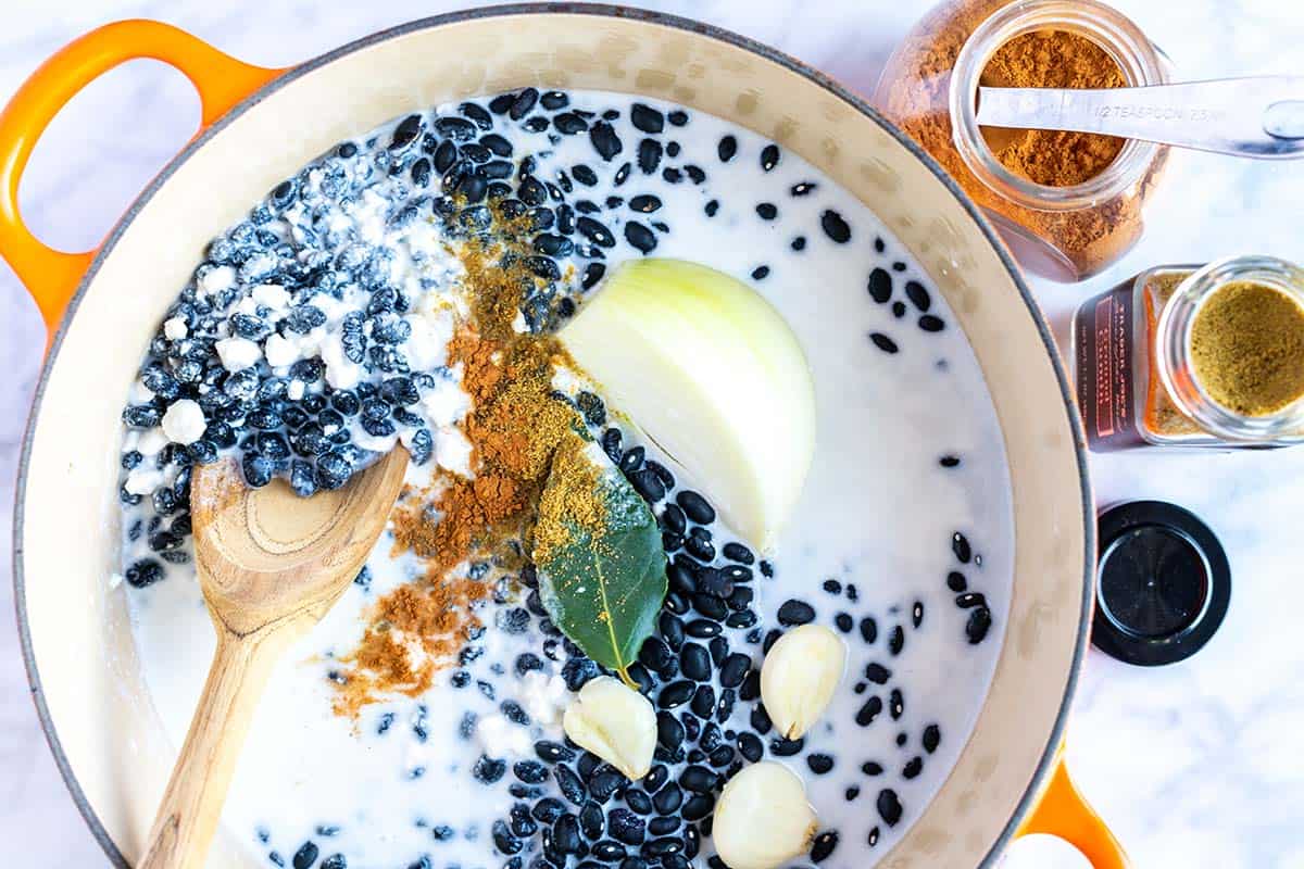 How to Make Coconut Black Beans: Ingredients in a pot ready to cook
