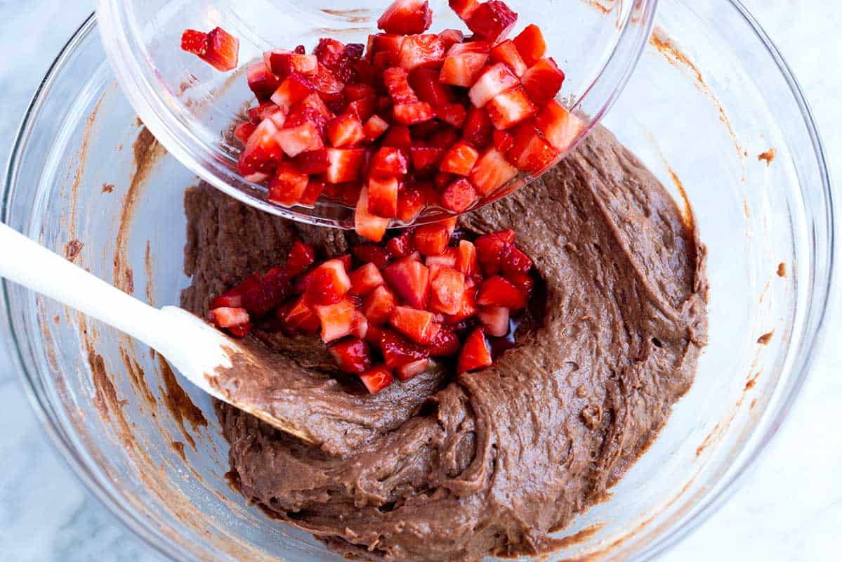 There's no need to beat the batter or use an electric mixer. Over mixing makes muffins heavy. How to Make Strawberry Chocolate Muffins: Adding strawberries to the batter