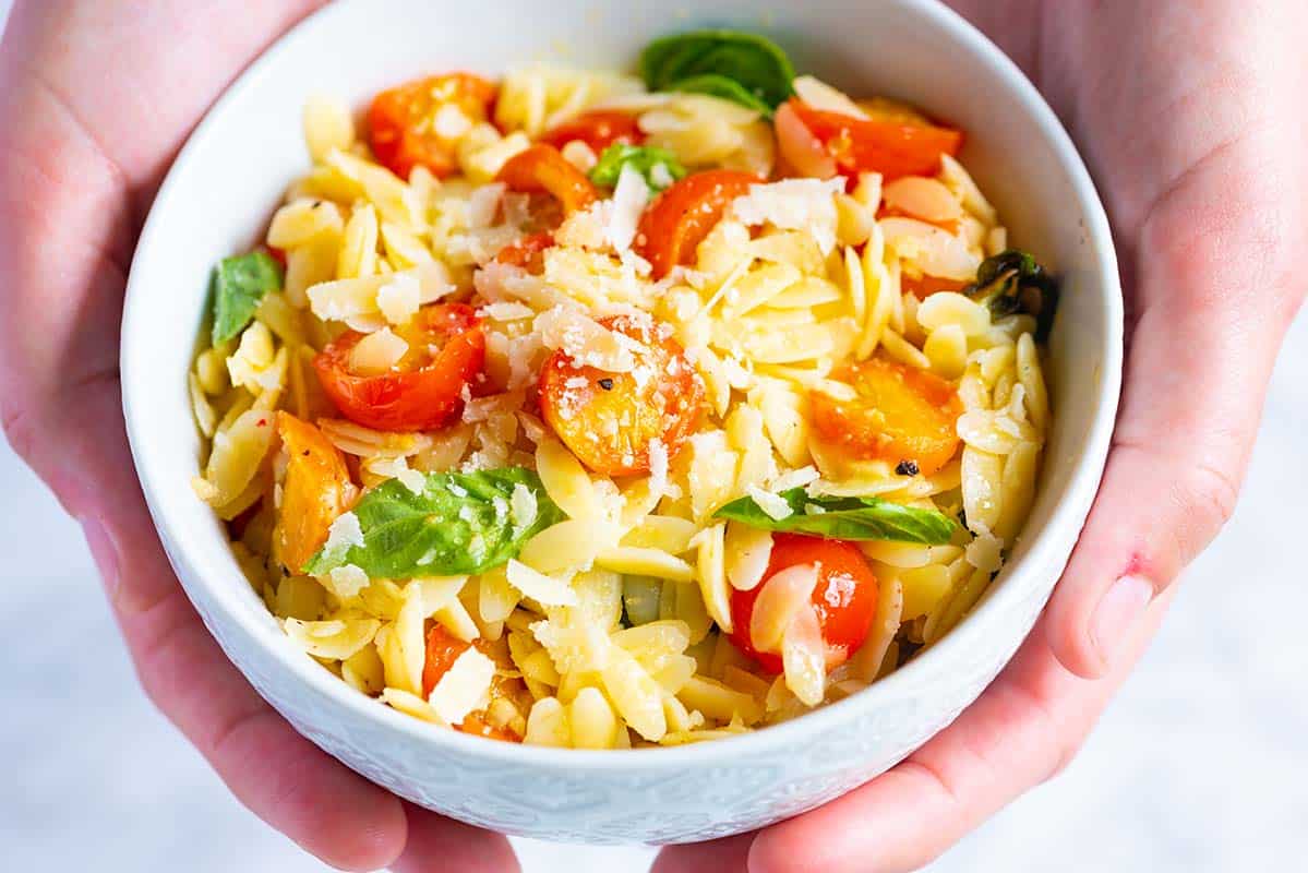 Orzo pasta with tomatoes, basil, parmesan and lots of garlic.