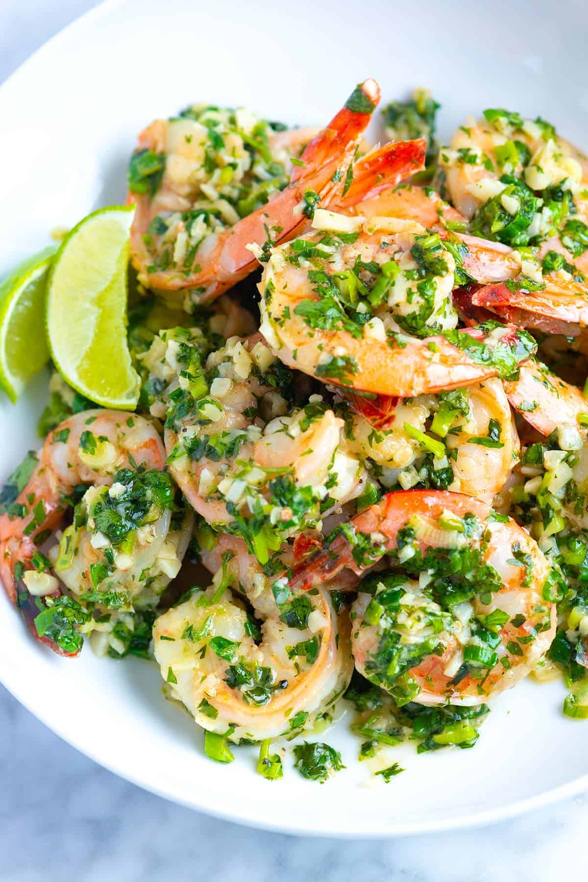 Cilantro Lime shrimp with lots of garlic piled up on a plate.