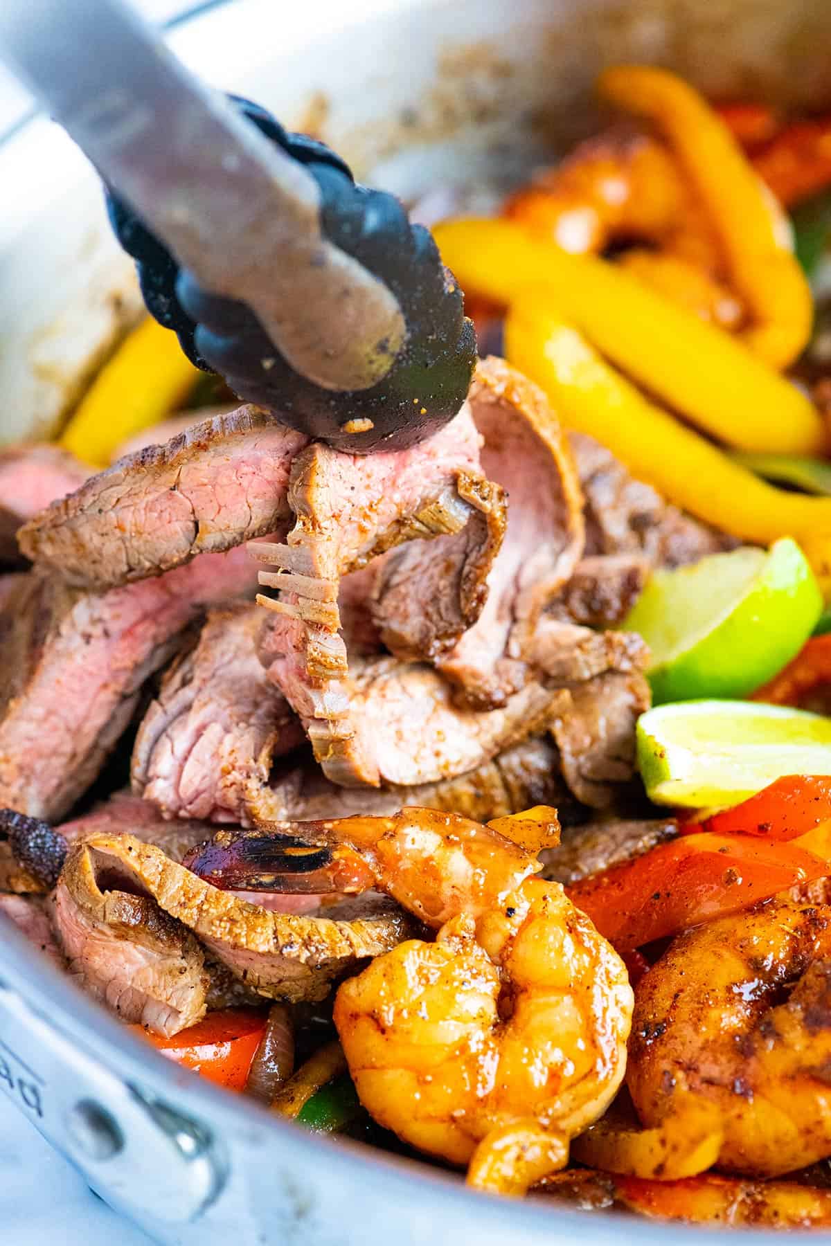 Steak, chicken, and shrimp fajitas