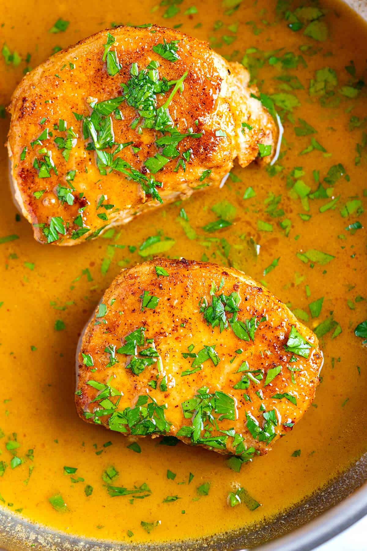 Pork Chops Cooking in a Skillet