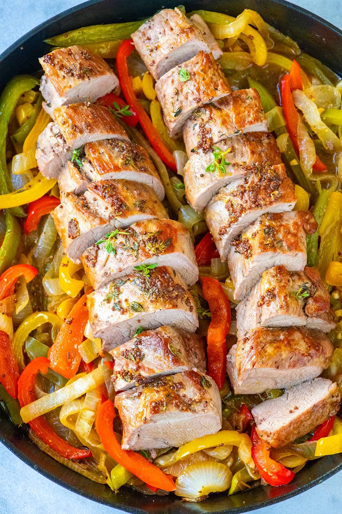 Sliced Pork Tenderloin with Peppers and Onions