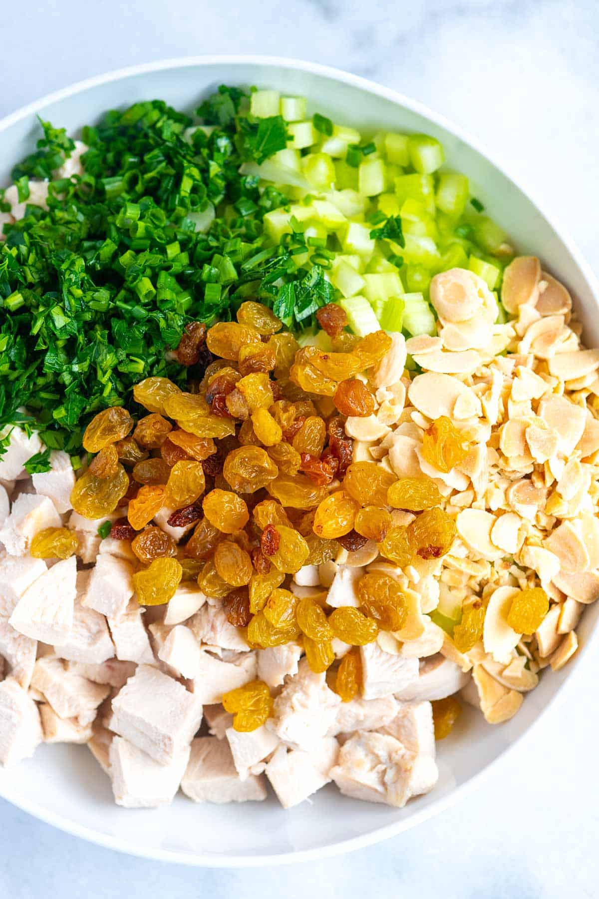 How to Make Creamy Chicken Salad: salad ingredients in a bowl