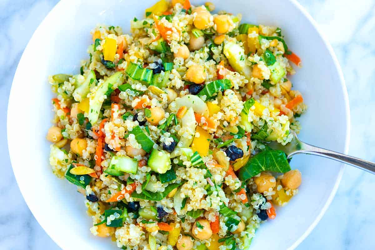 One of the Best Quinoa Salad recipes I've tried with quinoa, veggies, nuts, and chickpeas.