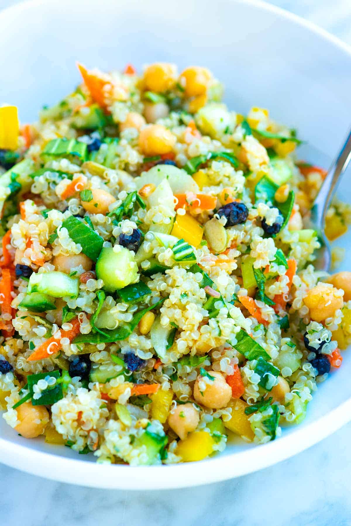 Easy quinoa salad with veggies, chickpeas, and dried fruit