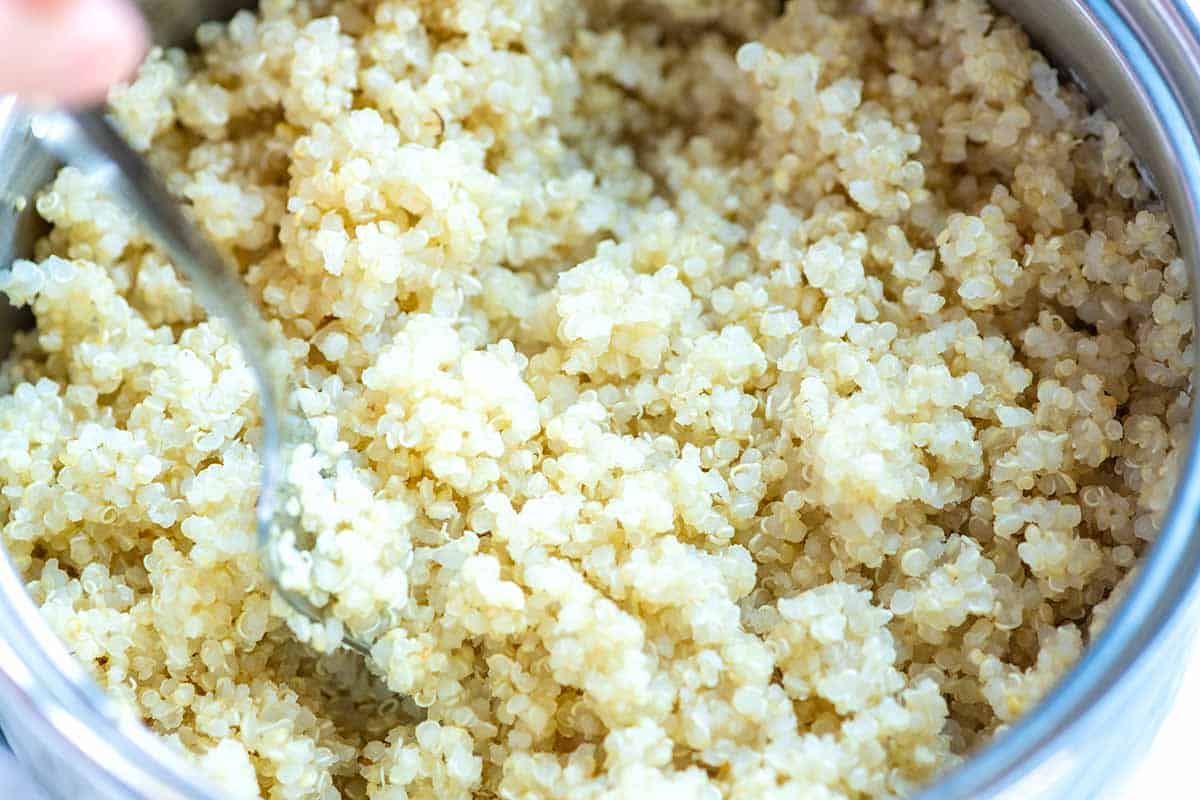 How to Cook Quinoa: Fluffing cooked quinoa on with a fork