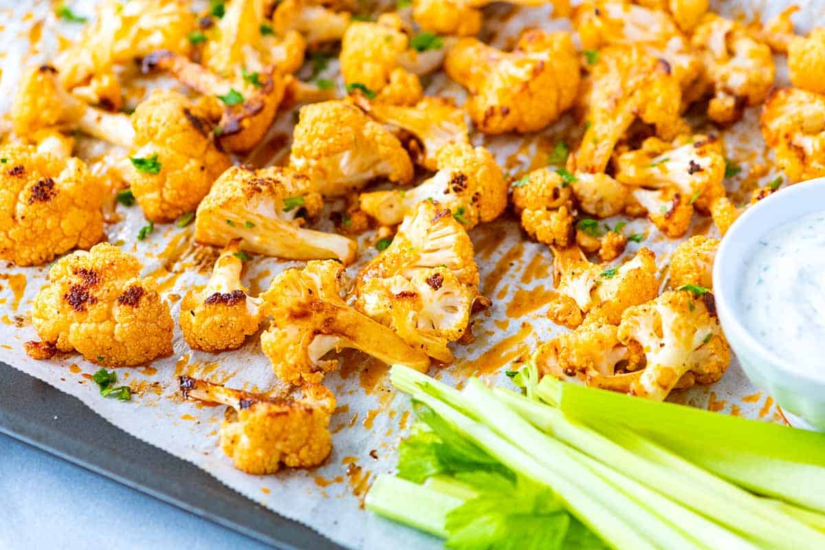 Baked Buffalo Cauliflower Wings with celery and blue cheese