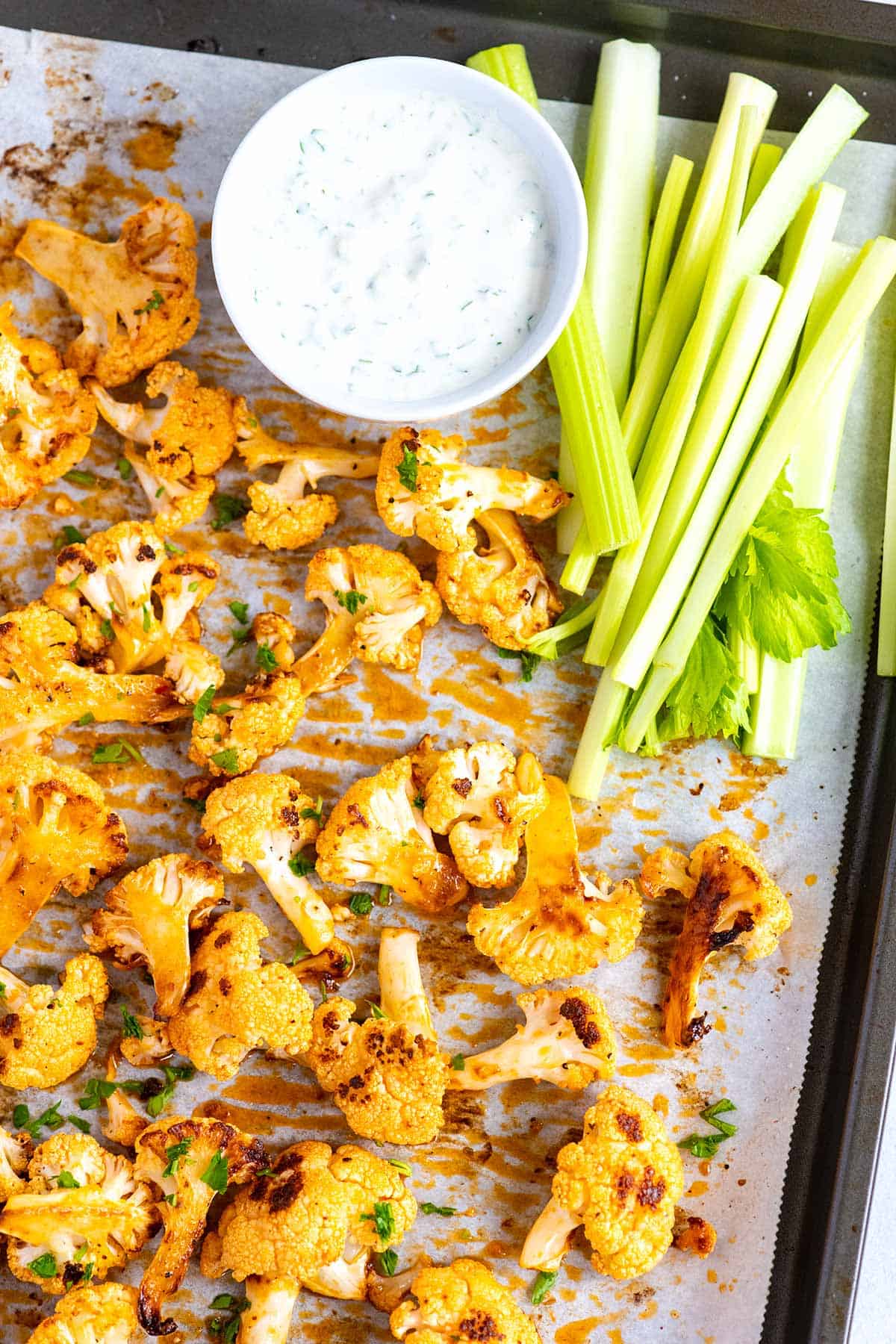 Buffalo Cauliflower Wings with celery and blue cheese dressing