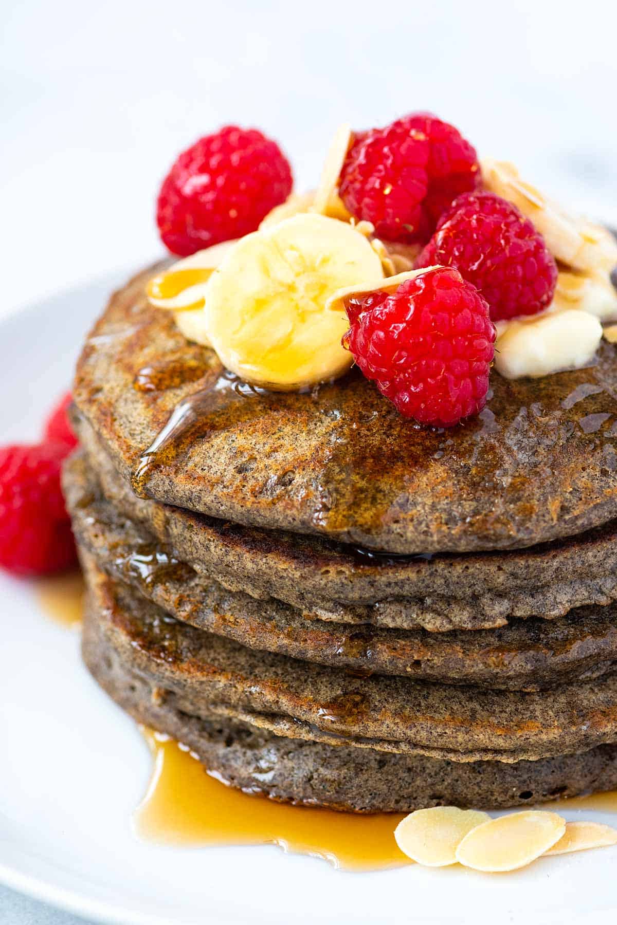 Buckwheat Pancakes with berries and sliced bananas