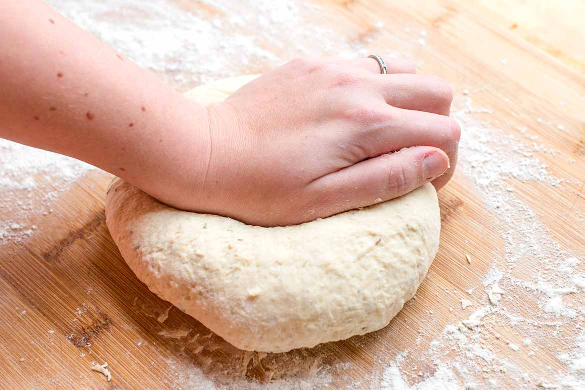 Kneading focaccia dough.