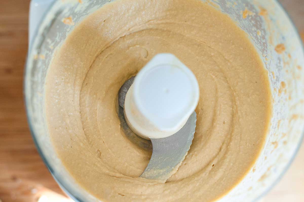 What our extra smooth hummus looks like after processing all the ingredients. (You only need 10 minutes to make homemade hummus.)