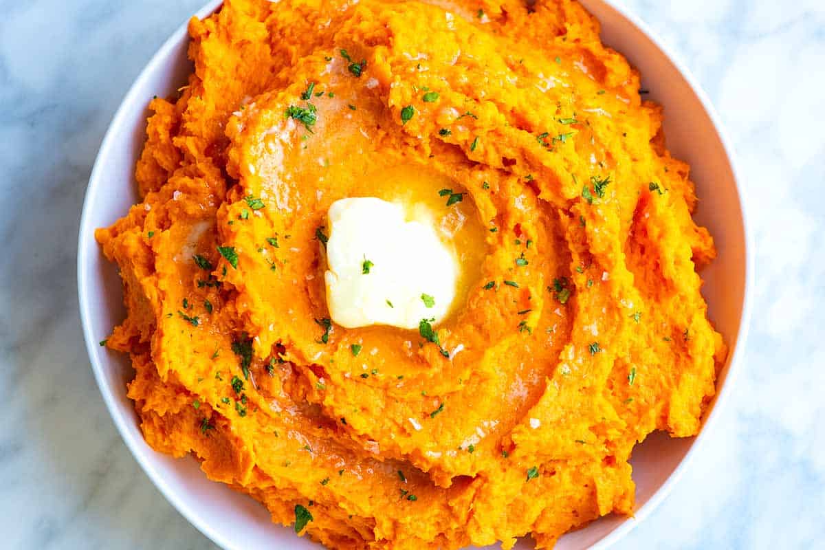 Mashed sweet potatoes with butter on top
