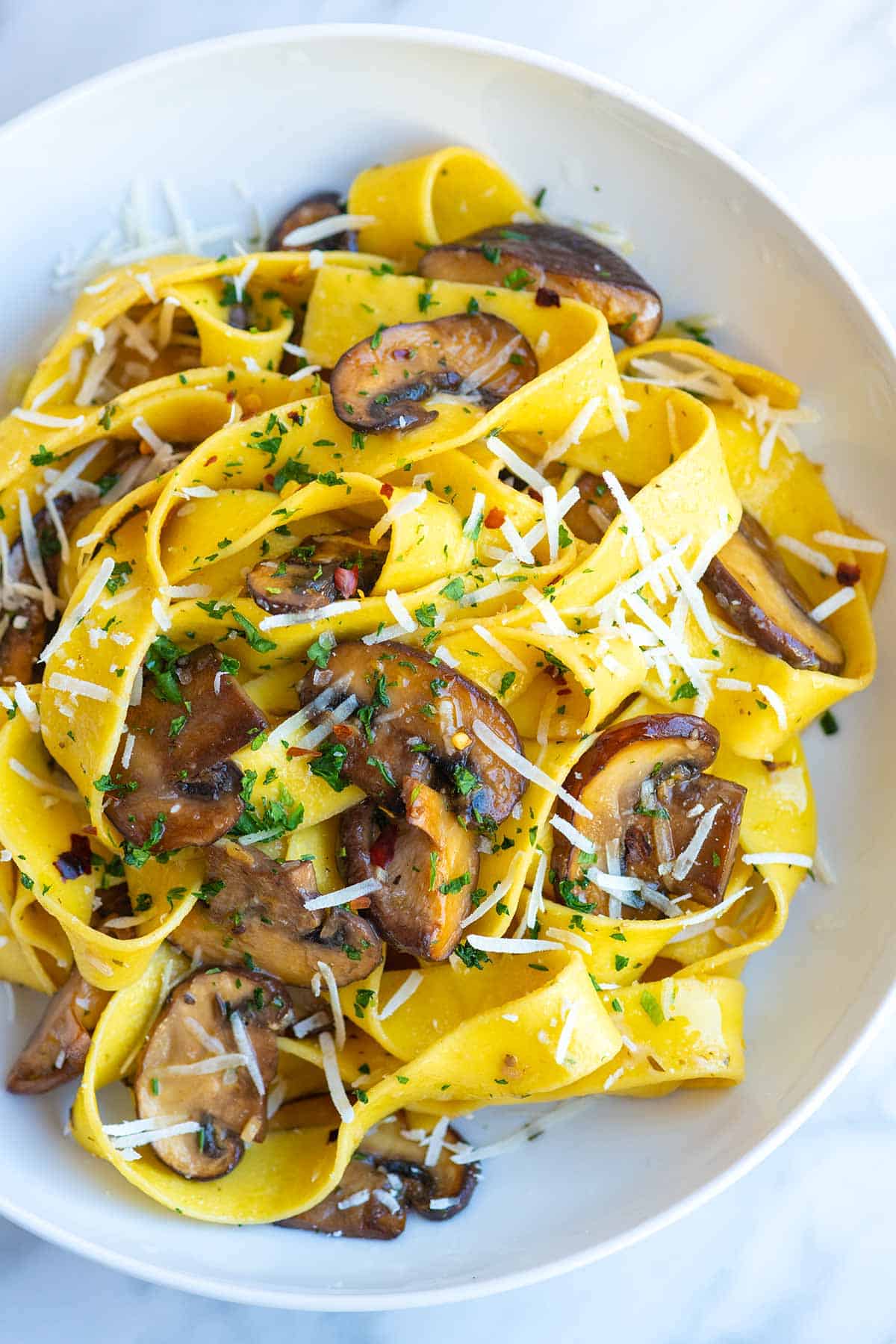Mushroom pasta recipe with the most delicious garlic butter mushrooms. Thanks to our no-fail method for cooking mushrooms, this easy pasta comes together in under 30 minutes and tastes amazing!