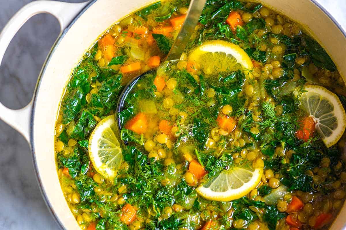 Lentil soup with kale, lemon, carrots, and turmeric