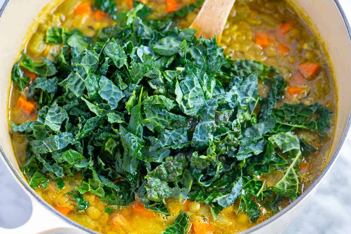 Adding kale to lentil soup