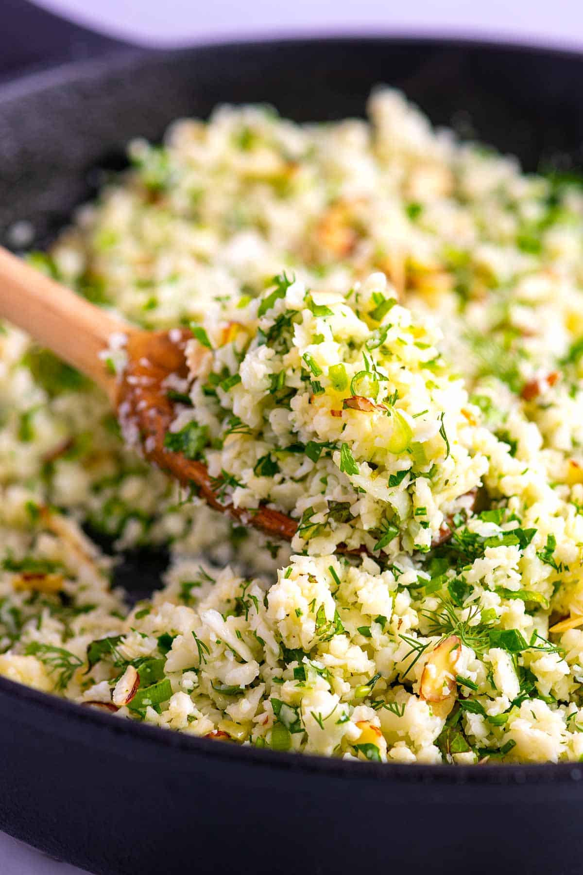 Cauliflower rice with herbs in a pan