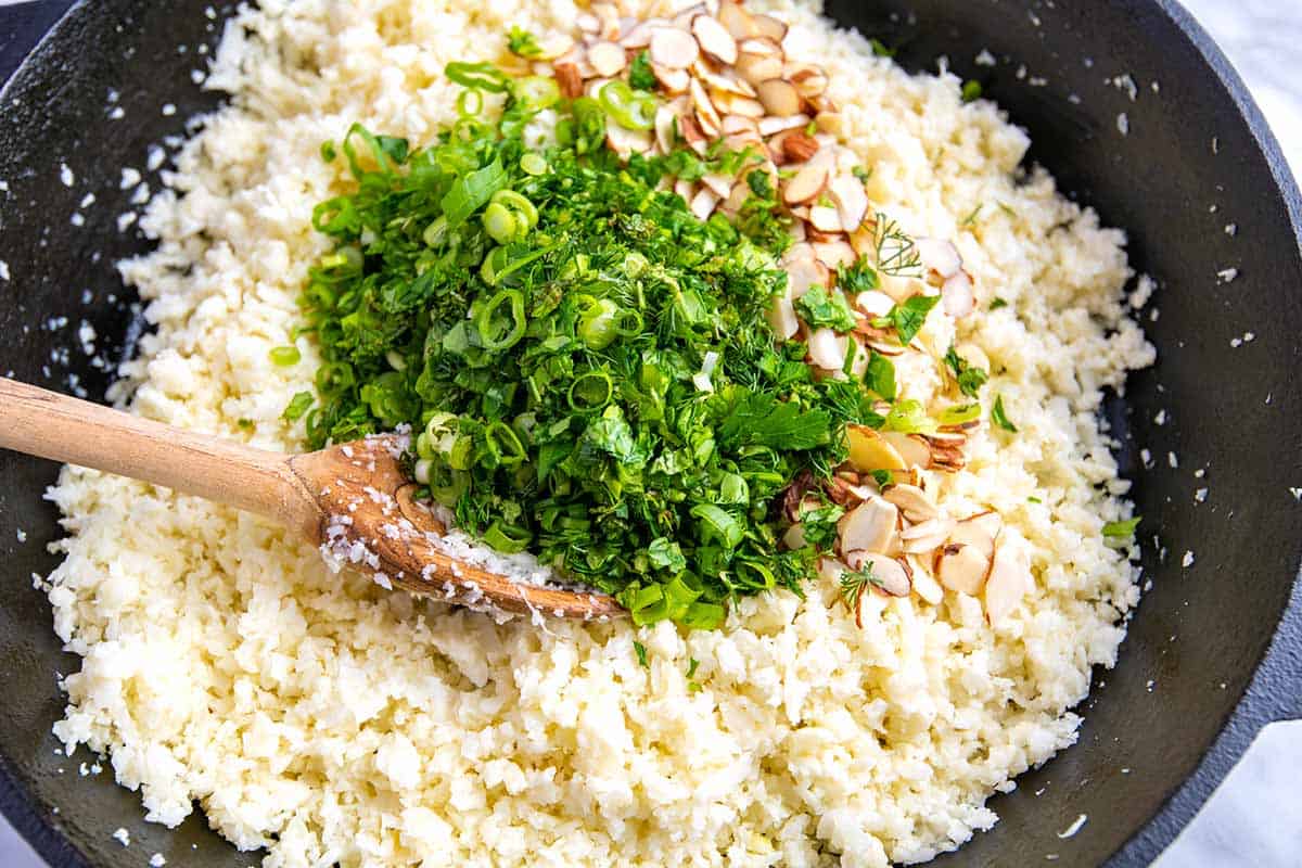 Add the herbs and roasted almonds to the cauliflower rice