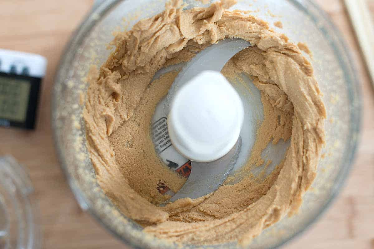 After a minute of processing, the peanut butter looks more like a thick paste.