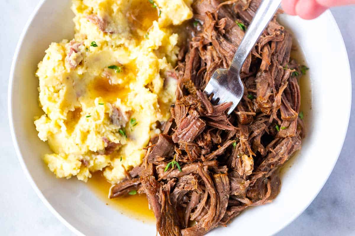 Pot roast served with creamy mashed potatoes.