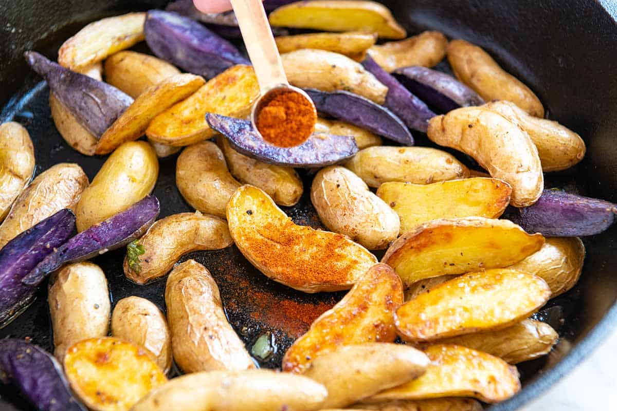 Roasted Fingerling Potatoes // When the potatoes are hot out of the oven, toss them with a little vinegar and smoked paprika. You'll be amazing at how much flavor this adds!