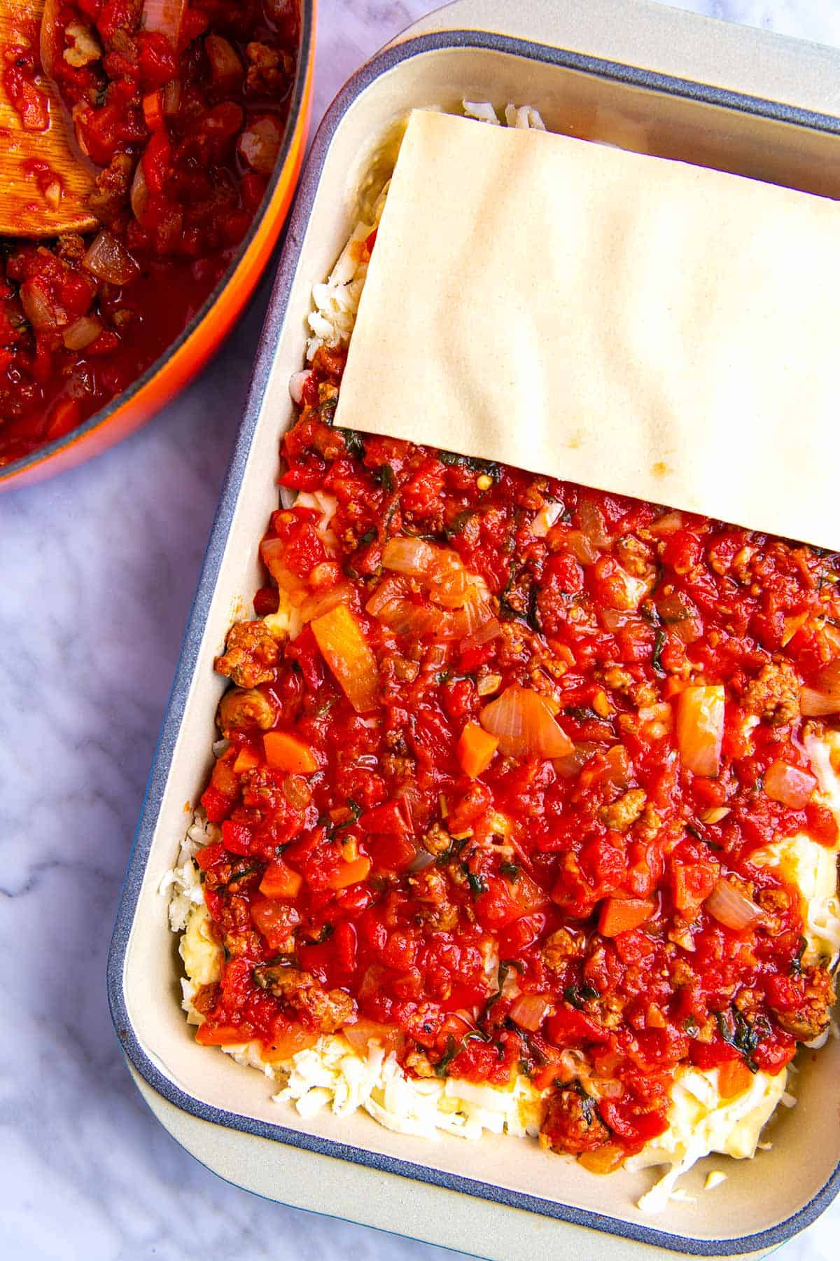 How to Make Easy Lasagna -- Layer noodles, ricotta, cheese, meat sauce, and more noodles.