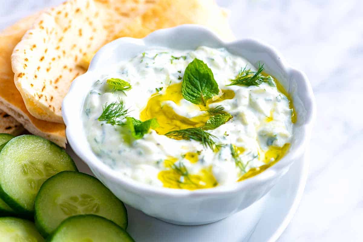 Tzatziki is a creamy, delicious, and simple sauce made with cucumber, yogurt, and fresh herbs.