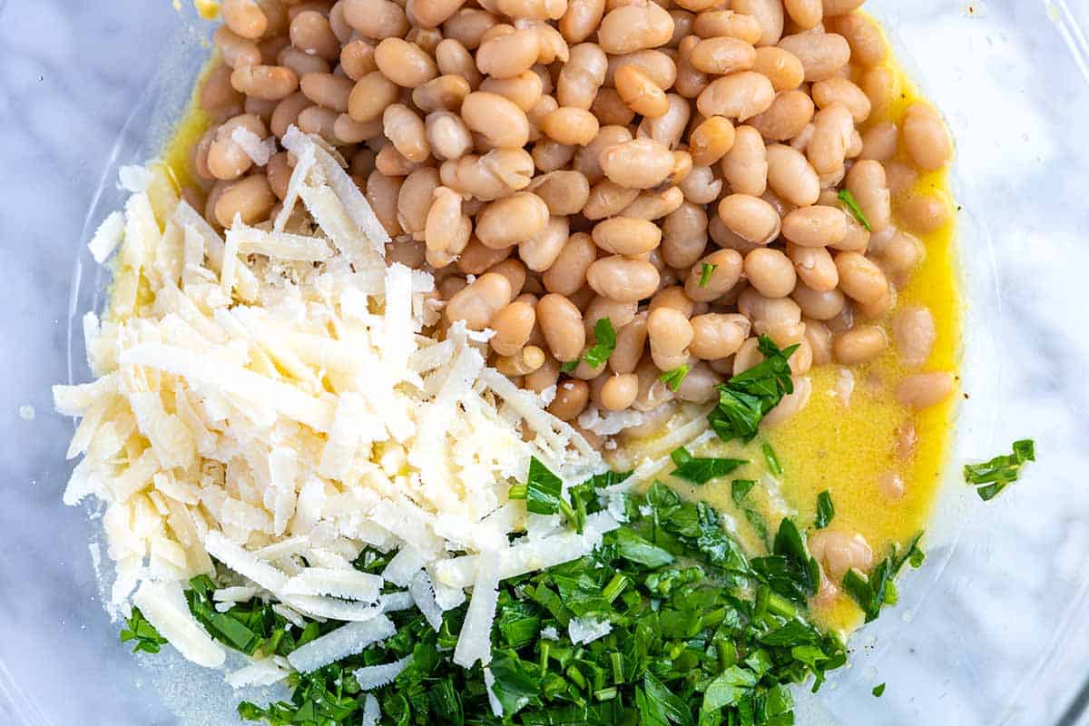 How to make our White Bean Salad -- mixing the ingredients