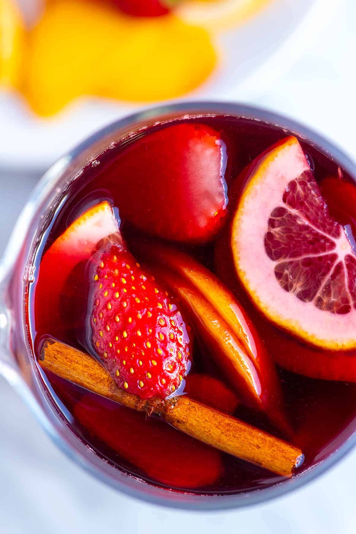 Sangria with Sliced fruit and a cinnamon stick