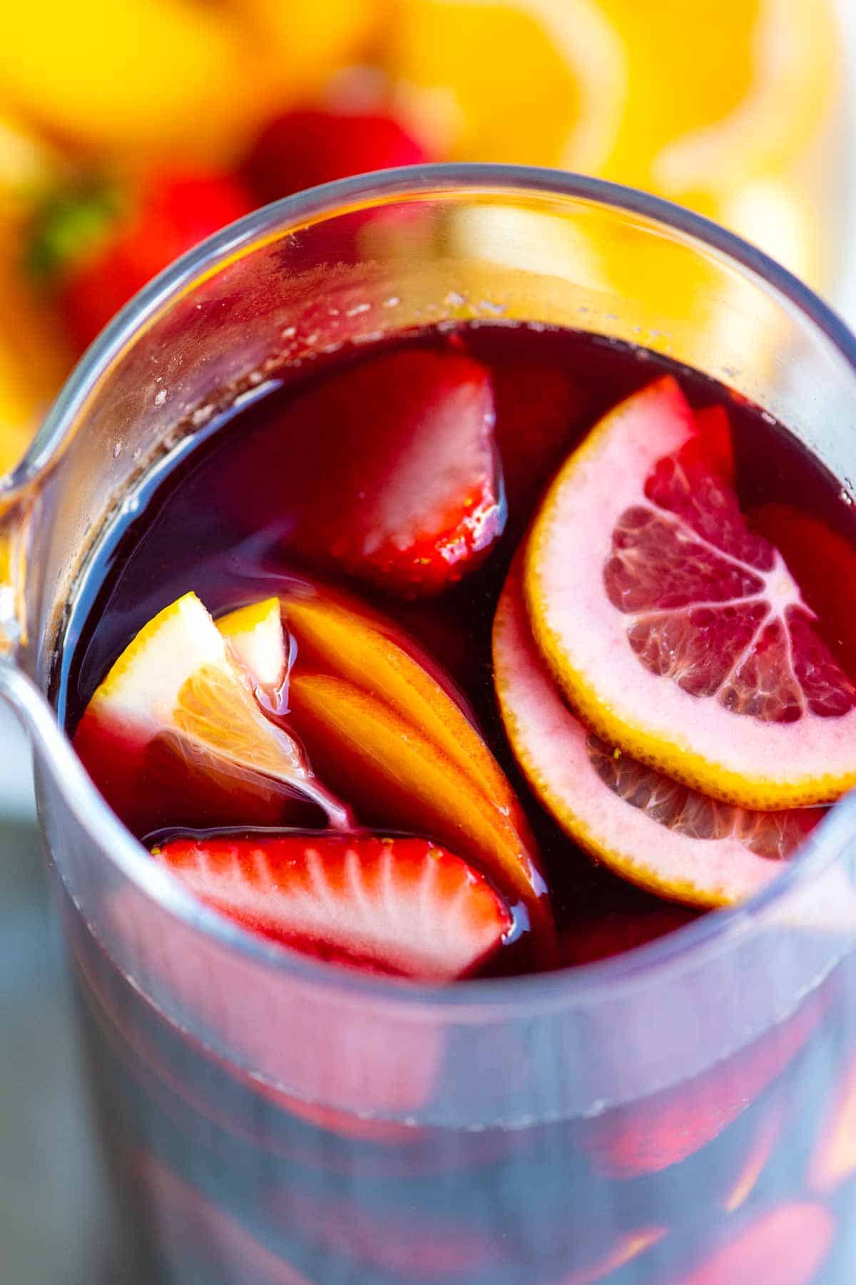 Sangria with fresh sliced oranges, lemon and strawberries