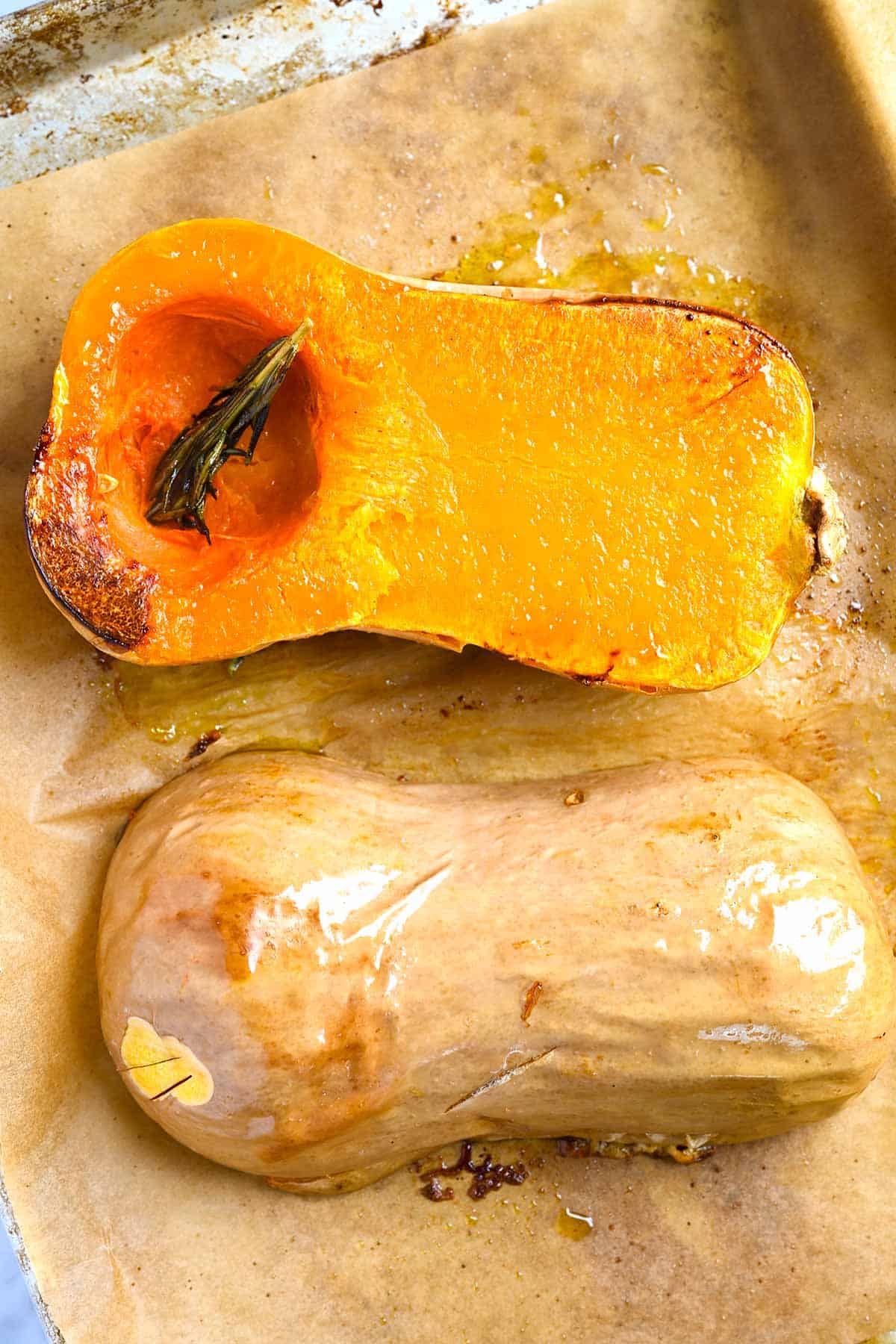 Similar to how we roast spaghetti squash, we like to roast the squash cut-side-down and tuck a sprig of rosemary behind each piece before roasting.